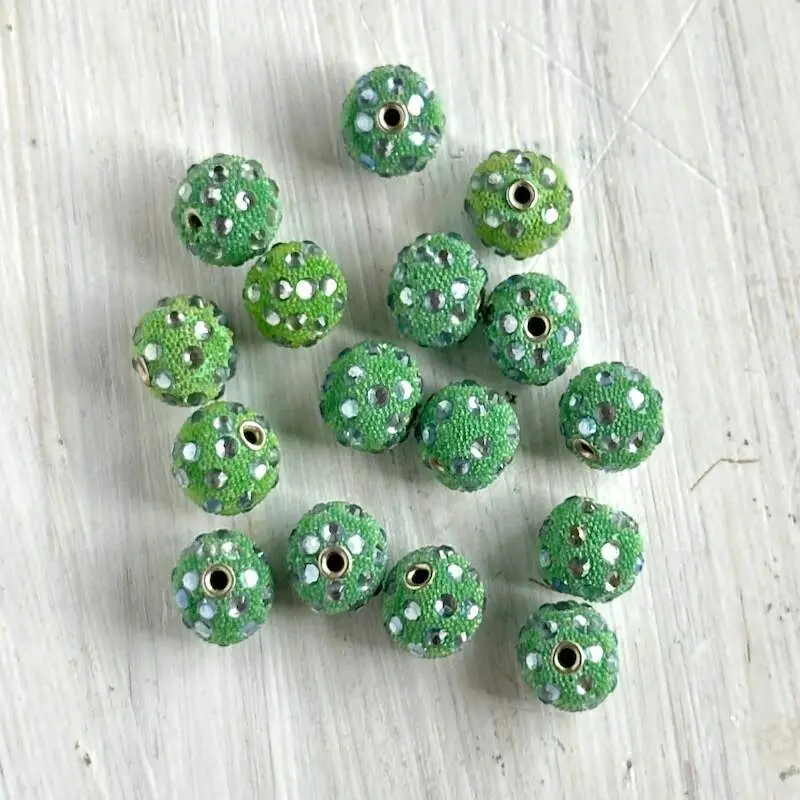 A lot of green rhinestones with rhinestones