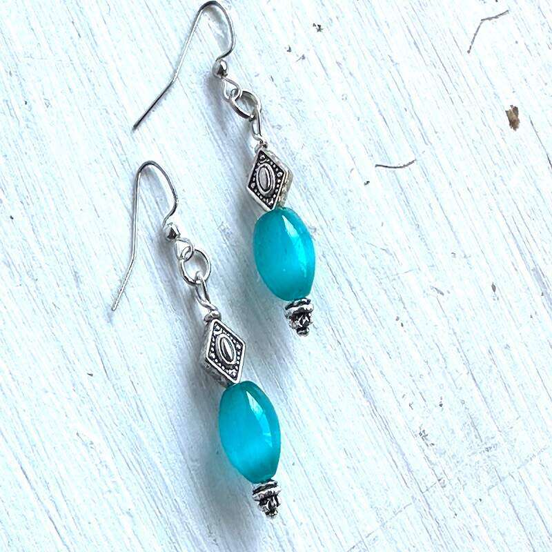 Blue cats eye glass earrings with silver diamond shaped beads