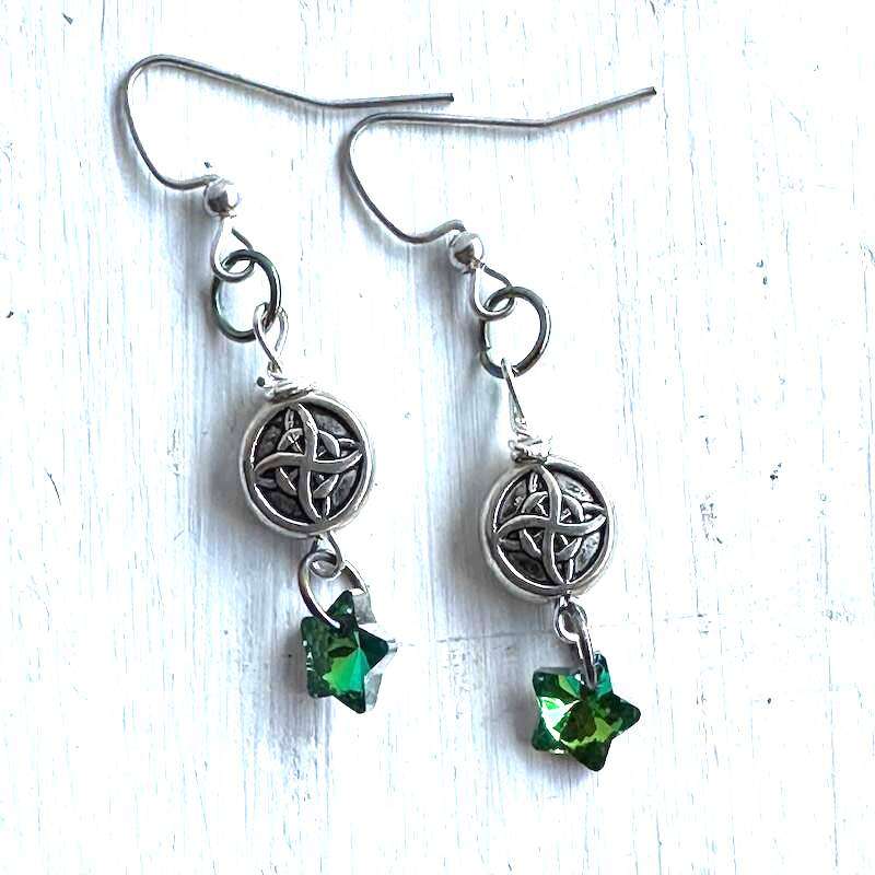 Celtic knot earrings with a blue green star